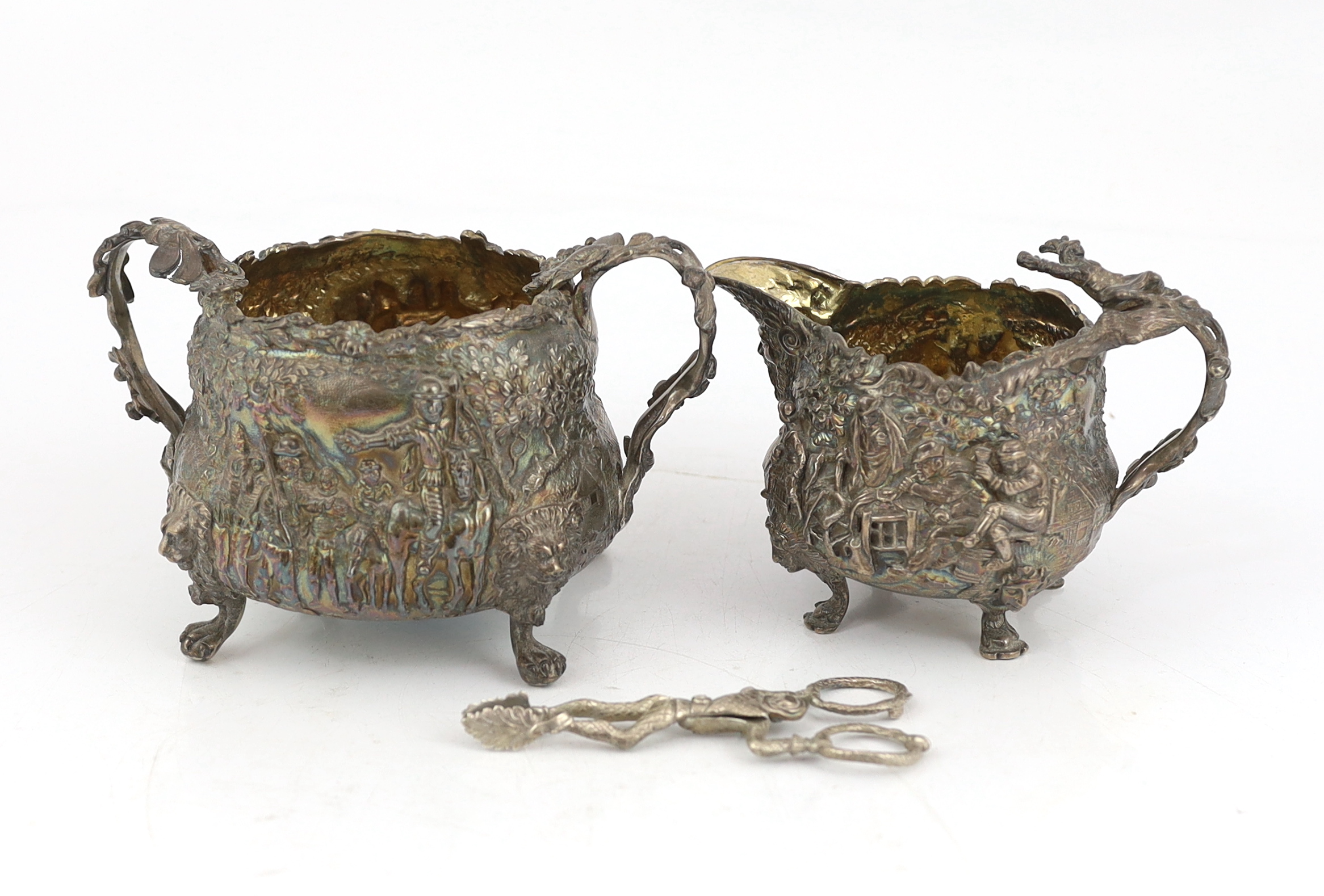 A George IV embossed silver sugar bowl and cream jug by Edward Farrell